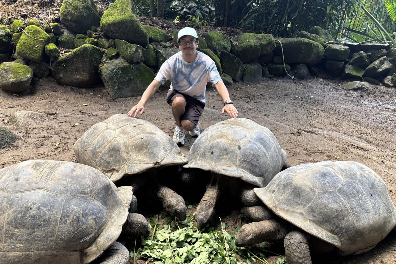 Pradeep with giant tortoises while travelling